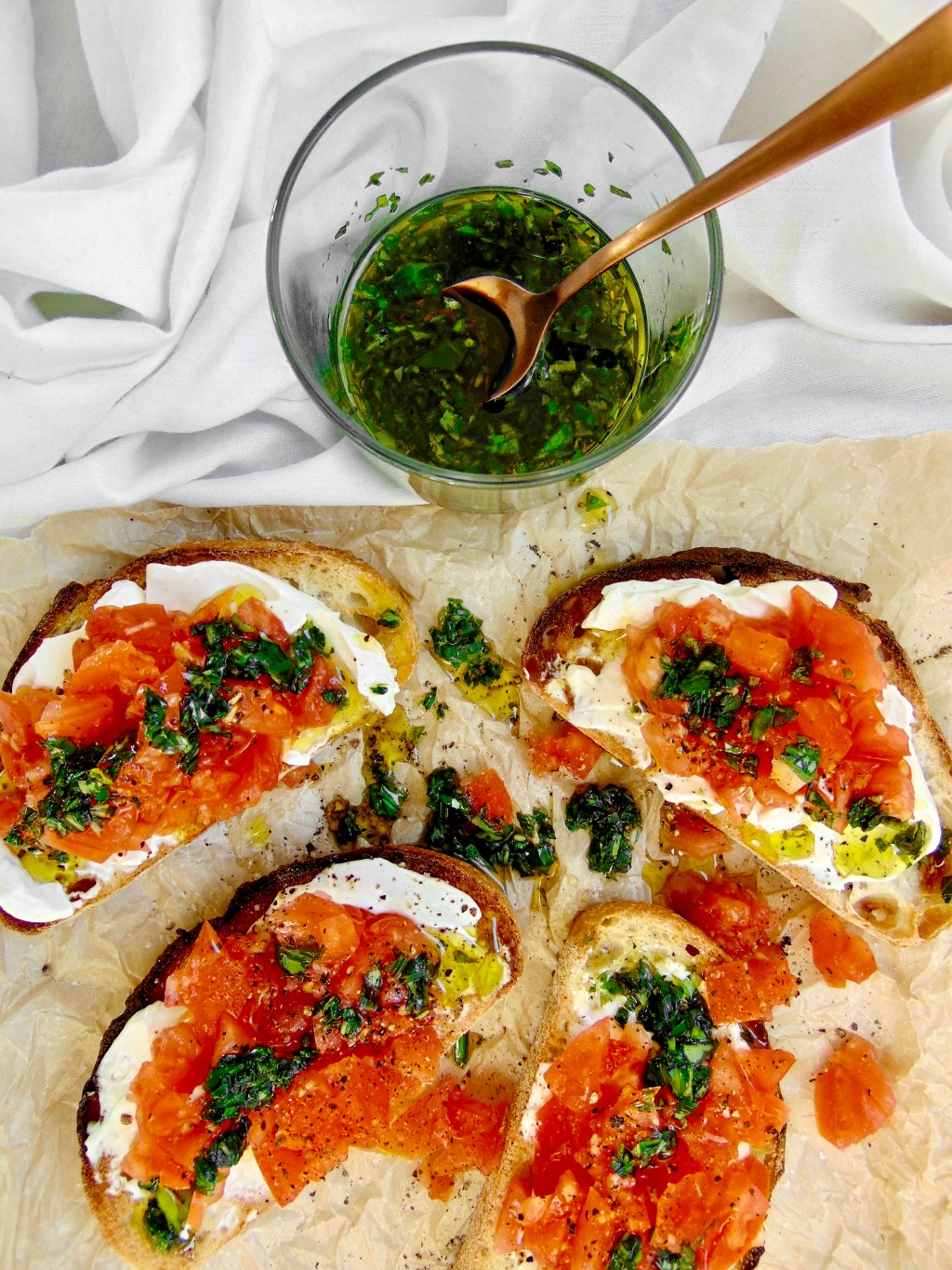 TOMATO & WHIPPED GOATS CHEESE TOASTS WITH BASIL&nbsp;OIL